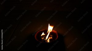 Spiritual flame natural candle burning on dark background Distanced View with Palo Santo wick for Smoke Clearing Energy Work Healing Aura in a Coconut Shell Beeswax Fuel Real Fire in 4k vídeo de Stock