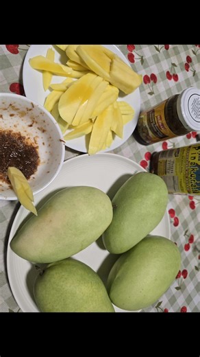 Philippine mango with bagoong (shrimp paste) is a beloved, tangy-sweet-savory snack or appetizer featuring crisp, unripe green mangoes dipped in salty, fermented shrimp paste, often with added sugar, chili, or calamansi for balanced flavor, creating a vibrant, addictive combination perfect for street food or with grilled dishes. Kain! | Tashaniro Lopez Canono