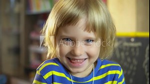 little girl shows tongue