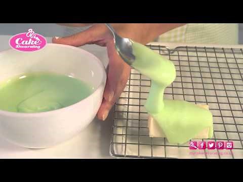 Pouring Fondant icing on a sponge finger