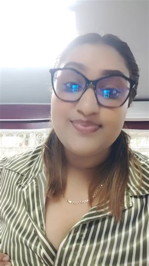 Adjusting Fashion: A Stylish Green Striped Shirt