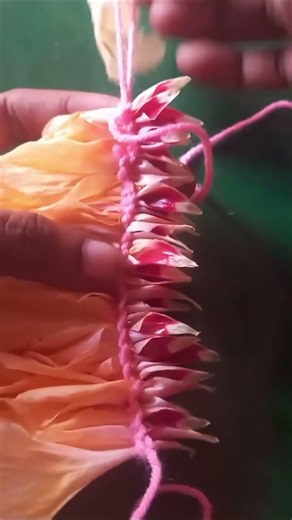 Tying flower petals with string to make decorations #flowerart #flowers #decoration #diy #shorts