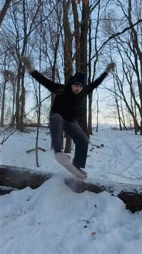 Snowskate ollie off ramp over fallen tree #snowskate #snow #ollie