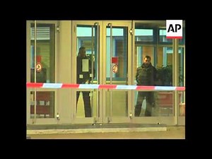 Candles, floral tributes outside school targeted in shooting attack