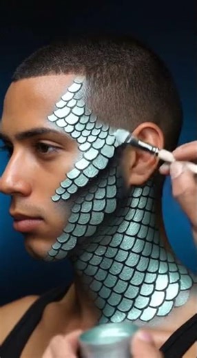 Close up shot of hands applying blue alien prosthetics to a model s face fast#moviemagicmomentsFast