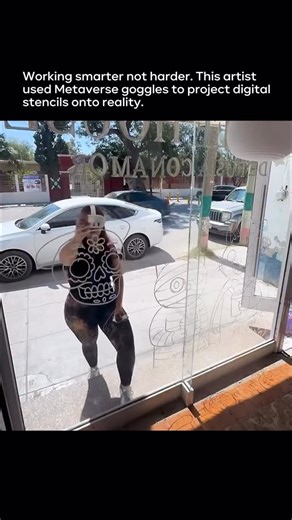 Artificial Intelligence & Technology on Instagram: "This isn’t freehand art. It’s precision-guided painting powered by mixed reality. The artist wears metaverse goggles with full color passthrough, allowing digital stencils to be placed directly onto a real storefront window before any paint is applied. The system scans the physical space in real time, locking the virtual design to the glass with exact scale, alignment, and perspective. Every line is mapped first in software, then traced perfect