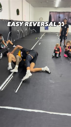 Miami Hawks Wrestling on Instagram: "HIGH CROTCH DEFENSE THAT FLIPS THE POSITION 🧠 This is about staying composed when you get cracked down the counter is there if you move the right way. He gets to a high crotch and cracks me down. I don’t try to stand up into it. My right hand grabs his elbow to stop him from climbing. I scoop my feet to the side, changing the angle and creating space. My left hand reaches underneath and grabs the leg. From there, I tuck my head, stay compact, and roll throug