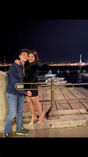 Romantic Nighttime Embrace by the Waterfront