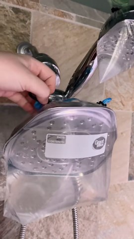 Cleaning shower heads with vinegar to remove mineral buildup