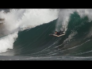 Slo-mo (180 fps) of surfer riding an air mattress at Wedge on a big day.