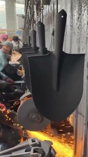 Industrial Process of Sharpening Steel Shovels in Factory