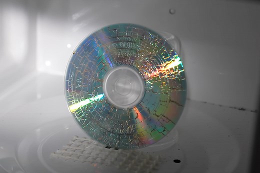 High-Speed Camera Captures CD Being Microwaved in Super Slow Motion at 80,000FPS