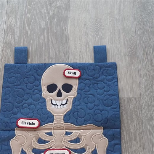 👻 Get Your Halloween Stitch On! ✔️ Stitch this Skeleton Hanger for your Halloween home décor 🎃 ✔️ No complex applique — bones & quilting make it fun to put together ✔️ Fits many hoop sizes: 5x7, 6x10, 7x12 and 9.5x14 👉 Make something hauntingly beautiful today! | Sweet Pea Machine Embroidery