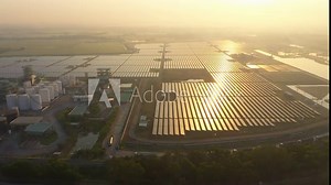 Solar Photovoltaic of solar farm aerial view, solar plant rows array of on the water mount system Installation in earthen pond, Floating solar or floating photovoltaics (FPV). Morning scene