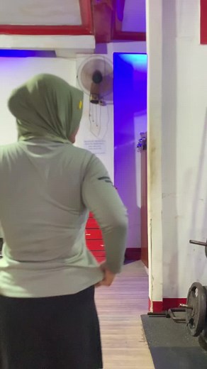 Woman Exercising in Gym with Unique Style