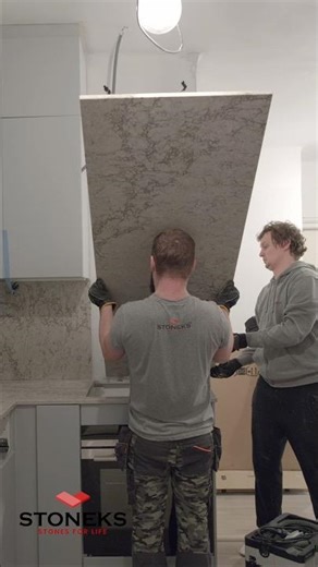 Wow! Watch us install this high Caesarstone wall panel. 🛠️