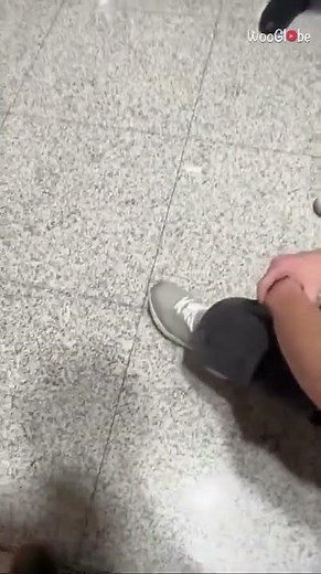 Bicep Cramp Prank at Airport: Hilarious Muscle Twitch || WooGlobe