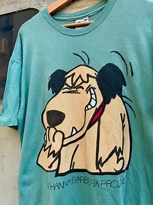 Muttley is the wheezy, snickering sidekick we never knew we needed, debuting in 1968’s Wacky Races—a Hanna-Barbera cartoon fever dream where cars did things cars probably shouldn’t do. Muttley belonged to Dick Dastardly, a mustache-twirling villain with the success rate of a wet match. The duo’s whole schtick was trying (and hilariously failing) to cheat their way to victory, with Muttley always tagging along like a furry gremlin with a PhD in passive aggression. What made Muttley iconic wasn’t 