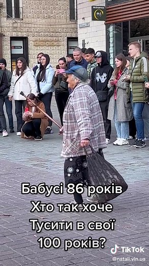 Elderly Woman Charms Crowd with Dance Performance