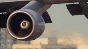 Jet engine close up with heat haze and atmosphere distortion caused by heat wave during hot summer time in the city, North America. High temperatures and intense climate change. Air pollution disaster