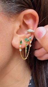 9.9K views · 3.3K reactions | Unleash your inner enchantress with our stunning sterling silver chain earrings, adorned with mesmerizing emerald green CZ stones. Pair it with our snake-shaped ear cuff for a bold and stylish look that will have all eyes on you. ✨ #EnchantingEmeralds #SnakeCharm #JewelryGoals | IOV jewelry | Facebook