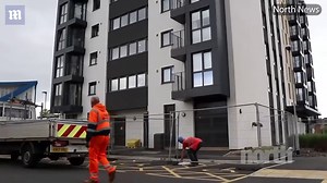 Workers put barriers around tower block with combustible cladding | Daily Mail Online