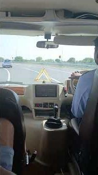 Tempo traveler taking turn towards Jaipur road on Delhi Mumbai expressway