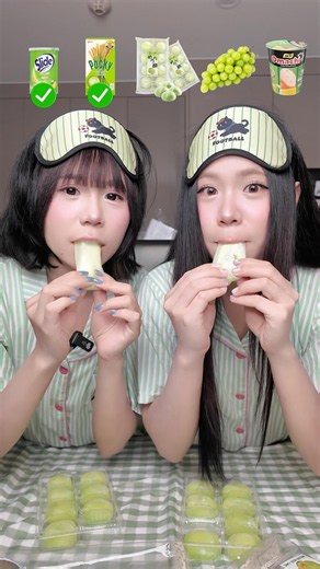 Twin sisters eating green food 💚