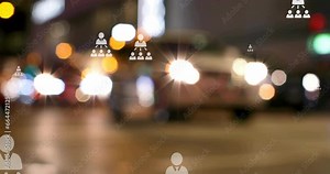 Animation of flowcharts over blurred vehicles stopped on signal and diverse people crossing street