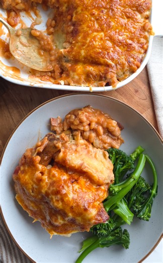 Jacket Potato Cheese & Bean Bake I honestly don't think that there's a dinner better than jacket potato cheese and beans...but my lot think it's a bit boring - THIS has completely changed their minds... All of the joy of a crispy jacket potato, but with a creamy cheese centre, smokey bacon beans and that golden, gooey toasted cheese top! I've written up the recipe below, let me know what topping I should try next! A x Feeds 4 4 large jacket potatoes Olive oil for roasting 7 rashers of smoked str