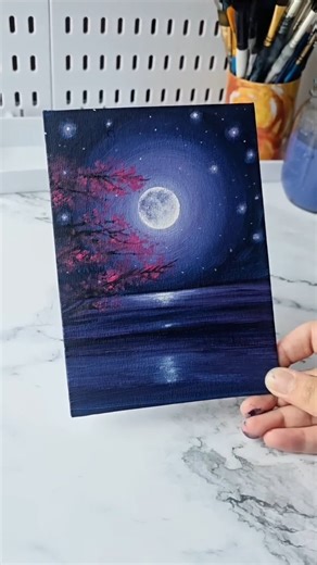 Artsy Emi ♡ on Instagram: "Easy way to paint a moonlight night sky / acrylic painting ideas for beginners 🌕 . . . . . . . . . . . . . . DM for credit or remove #artshorts #paintingideas #paintingforbeginners #acrylicpaintingtechniques #acrylicpaintingoncanvas #shortsvideo #artideas #acrylicpainting #pinkcloud #canvas"