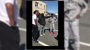 Inspiring stranger stops street fight filmed by teens on cellphones, schools kids