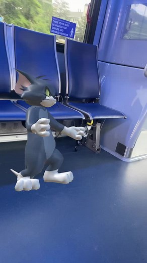 Animated Gray Cat Dancing on Public Transport