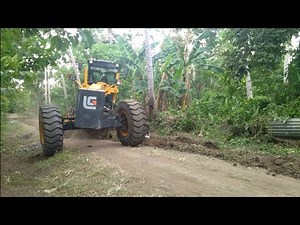 Skill grader operator ditching and clearing on road, (Equipment & Operator Channel)