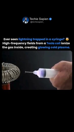 Techie Sapien - AI | Robotics | Next-gen Tech on Instagram: "Electricity in a Syringe? 🤯 Tesla Coil Makes Cold Plasma Glow Cold Plasma in a Syringe — Tesla Coil Meets Science! ⚡ Ever seen a syringe filled with lightning? In this incredible experiment, high-frequency electric fields from a Tesla coil ionize the air inside a syringe, forming a glowing cold plasma. Unlike regular hot plasma, this one is cool to the touch and safe to observe — showing how science can turn electricity into art! This
