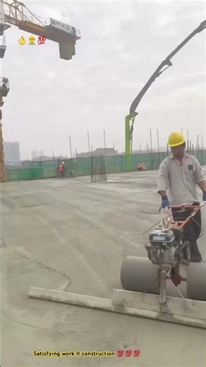 Roller machine spreading concreted pavement smoothly