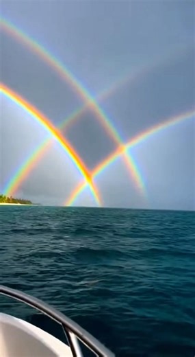 Ocean portals. 🌊🌈 This isn’t a filter—it’s a rare phenomenon called a Supernumerary Rainbow combined with a Reflection Rainbow. 💡 The Science: The Neon Ripples: Light is acting like a wave here. As it hits the mist, the waves collide (diffract), creating an interference pattern of bright neon bands instead of a standard bow. The "Gate" Shape: Sunlight bounced off the ocean surface to create a second "virtual sun." This projected a second rainbow that intersects with the first one, creating th