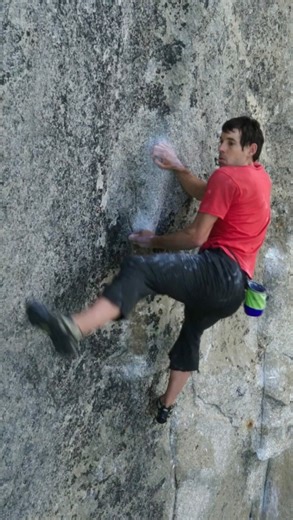Jimmy Chin on Instagram: "Hundreds of meters off the deck, @alexhonnold tackles the Boulder Problem, the crux of Freedrider (5.13a). @m_synnott and @mikeylikesrocks look on with bated breath. To become the first person to free solo El Capitan, Alex had to rely on microscopic holds, barely-there friction — and a lifetime of preparation. @natgeo @thenorthface"
