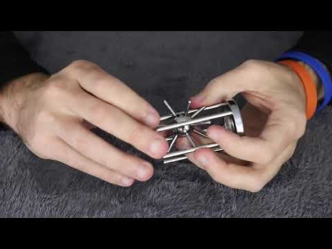 Solving The Caged SPIKED BALL Puzzle