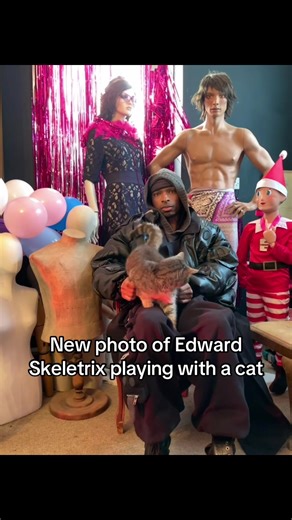 Edward Skeletrix's Playful Moment with a Cat