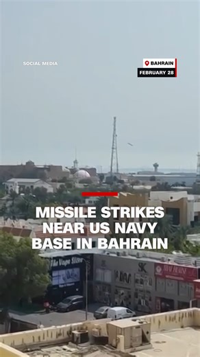 Video geolocated by CNN shows the moment a missile struck near the US Navy base in Bahrain. In the video, a large explosion can be heard. A large plume of smoke is then seen rising from the area around the base. Follow live updates: https://cnn.it/4cSM5YA | CNN
