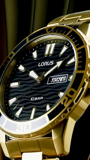 Featuring a classic 3-hand design, an aluminum bezel, and a captivating diver look, this watch boasts a transparent print on its dial. The sleek Black Sunray dial color, complemented by a luxurious golden case and band, exudes sophistication and elevates your every look. Stand out from the crowd and make a bold statement with our irresistible timepiece. https://www.loruswatches.com/Watch/RH362AX9 Model# RH362AX9 #Loruswatches | Lorus Watches