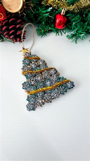 1.7K views · 15 reactions | I thought this was going to take fifty of these mini rolled paper flowers but it only took 29! This is another $1 ornament from Target that I add a little paper to. What do you think? Grab the free rolled flower template on my blog today  #papercraft #cardstock #rolledroses #rolledflowers #paperflowers #diychristmas #diyornaments | Dinosaur Mama SVG | Facebook