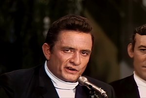 Johnny Cash - Folsom Prison Blues (1955) In the 1950s, Johnny Cash, with his resonant voice and compelling storytelling, became a country and rockabilly icon. His song "Folsom Prison Blues," inspired by a 1953 movie about Folsom Prison, stands as a testament to his legacy. Told from a prisoner's perspective, it captures themes of regret and longing for freedom. The line "I hear the train a-comin', it's rolling 'round the bend" evokes a poignant sense of yearning. Cash transformed this wake-up ca