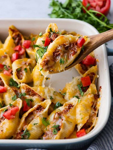 Recipe here: https://therecipecritic.com/taco-stuffed-shells/ These taco stuffed shells are bursting with taco meat and melty cheese and loaded with all your favorite toppings. | The Recipe Critic