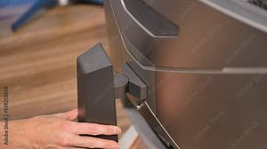 Computer Monitor is Adjusted Turning Left and Right.