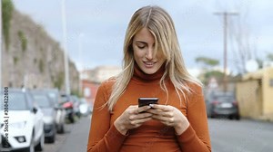 social, technology - beautiful girl reads a post on facebook and smiles