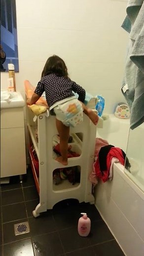 Two years old is getting ready for nappy change!
