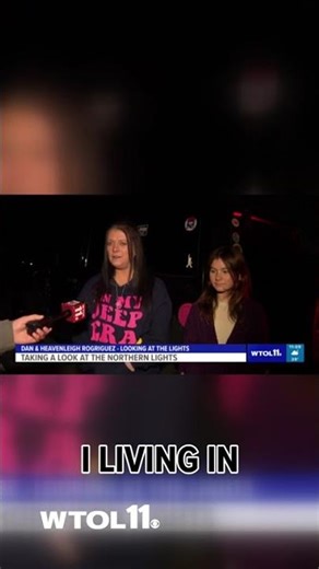 Onlookers gather at Maumee Bay State Park to view northern lights