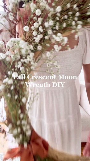 You have to try my favorite fall craft from last year! This crescent moon wreath is a simple diy and looks so beautiful with your autumn decor. I used a wire wreath form cut to shape and florals from Trader Joe's! You could add dried orange slices, moss, mushrooms and more #fallcrafts #falldecor #falldiy #tiktokcrafts #crafting #fallwreath #wreath #wreathdiy #moonwreath #cottagecoreaesthetic #homedecor #academiaaesthetic